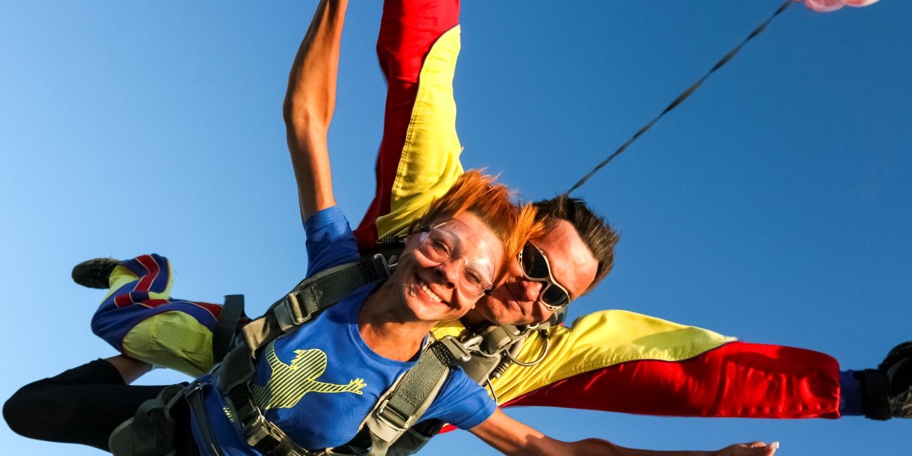 Tandem jump. The girl with the instructor in freefall.